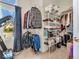 Organized walk-in closet featuring shelving, hanging rods, and natural light, providing ample storage space at 3559 Towne Dr, Carmel, IN 46032