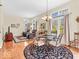 Cozy dining area with natural light, elegant chandelier, and seamless flow to the living area at 3559 Towne Dr, Carmel, IN 46032