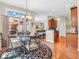 Bright dining area with a glass table, wrought iron chairs, hardwood floors, and natural light at 3559 Towne Dr, Carmel, IN 46032