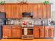 Beautiful kitchen with stainless steel appliances, stone backsplash, and custom wood cabinetry at 3559 Towne Dr, Carmel, IN 46032
