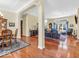 Bright open concept showcases hardwood floors connecting living and dining spaces at 3559 Towne Dr, Carmel, IN 46032