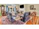 Living room with fireplace, furniture, hardwood floors, and natural light at 3559 Towne Dr, Carmel, IN 46032