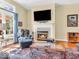 Bright living room showcasing a cozy fireplace, stylish decor, and comfortable seating arrangement at 3559 Towne Dr, Carmel, IN 46032