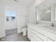 Bright bathroom featuring double sink vanity, tile floors, and large mirror at 379 Antioch St, Greenfield, IN 46140