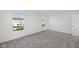 Carpeted bedroom bathed in sunlight through two windows overlooking the backyard at 379 Antioch St, Greenfield, IN 46140