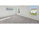 Bright bedroom with plush carpeting and multiple windows, offering great natural light and views at 379 Antioch St, Greenfield, IN 46140