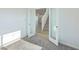 Inviting bedroom with carpet, glass paneled door, and a view of the staircase at 379 Antioch St, Greenfield, IN 46140