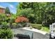 Beautiful backyard with a patio featuring outdoor seating, a decorative tree and manicured greenery at 380 Raintree Dr, Zionsville, IN 46077