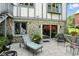 Relaxing backyard with a lounge chair, patio set, and beautiful landscaping at 380 Raintree Dr, Zionsville, IN 46077