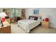 Inviting bedroom featuring a double bed, matching wooden furniture, bright window and neutral tones at 380 Raintree Dr, Zionsville, IN 46077