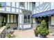 Charming patio with stone accents, neutral color scheme, outdoor seating and well manicured plants at 380 Raintree Dr, Zionsville, IN 46077