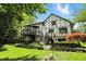 Charming two-story home with a well-maintained lawn, multi-level back deck and beautiful landscaping at 380 Raintree Dr, Zionsville, IN 46077