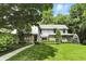 Beautiful home featuring a well-manicured front lawn, mature trees, and charming curb appeal at 380 Raintree Dr, Zionsville, IN 46077