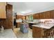 Spacious kitchen featuring custom cabinets, granite countertops, and a central island at 380 Raintree Dr, Zionsville, IN 46077