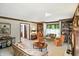 Bright living room with fireplace, built-in shelving, and decorative wood trim at 380 Raintree Dr, Zionsville, IN 46077
