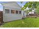 A well-maintained backyard features a wooden deck, lush grass, and a privacy fence, creating an inviting outdoor space at 3843 Grove Tree Ln, Indianapolis, IN 46203