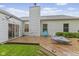 Backyard with a wooden deck, green lawn, and access to the house through sliding doors at 3843 Grove Tree Ln, Indianapolis, IN 46203