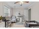 Bright Bedroom is equipped with a ceiling fan, crib, and changing table with a dedicated space at 3843 Grove Tree Ln, Indianapolis, IN 46203