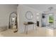 Bright foyer featuring a modern mirror and stylish table, creating an inviting entrance at 3843 Grove Tree Ln, Indianapolis, IN 46203