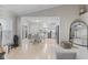 Bright kitchen features white cabinets, stainless steel appliances, and adjacent breakfast nook with round table at 3843 Grove Tree Ln, Indianapolis, IN 46203