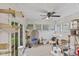 Bright sun room with plenty of windows, white wood paneling, and custom cat structures at 3843 Grove Tree Ln, Indianapolis, IN 46203