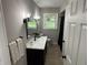 A modern bathroom features a sleek vanity and contemporary fixtures at 3906 N Lanewood Dr, Muncie, IN 47304