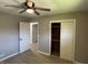 This bedroom features a closet and two bright doors at 3906 N Lanewood Dr, Muncie, IN 47304
