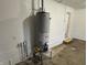 Garage view featuring the water heater at 3906 N Lanewood Dr, Muncie, IN 47304