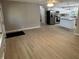 Open-concept living space featuring stylish floors that connect the space to the updated kitchen at 3906 N Lanewood Dr, Muncie, IN 47304