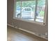 The view through the window shows the neighboring properties at 3906 N Lanewood Dr, Muncie, IN 47304