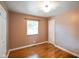 Cozy bedroom featuring hardwood floors, natural light, and a spacious closet at 45 Kirk E Dr, Indianapolis, IN 46234