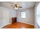 Bedroom featuring hardwood floors, a ceiling fan, a closet, and a window at 45 Kirk E Dr, Indianapolis, IN 46234