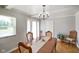 Charming dining room featuring hardwood floors and a stylish chandelier for intimate gatherings at 45 Kirk E Dr, Indianapolis, IN 46234