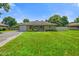 Charming single-story home with a well-manicured lawn, stone details, and a welcoming entrance at 45 Kirk E Dr, Indianapolis, IN 46234