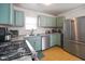 Bright kitchen featuring stainless steel appliances and stylish cabinets for storage at 45 Kirk E Dr, Indianapolis, IN 46234