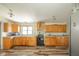 Functional kitchen with wood cabinets, ample counter space, and a window above the sink at 4644 E 150 N, Anderson, IN 46012
