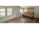 Cozy living room featuring hardwood floors, a comfortable couch, and plenty of natural light from multiple windows at 4644 E 150 N, Anderson, IN 46012