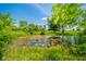 Peaceful pond surrounded by lush greenery, providing a serene natural habitat and picturesque scenery at 4644 E 150 N, Anderson, IN 46012