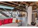 Spacious unfinished basement with concrete columns and ductwork, offering potential for customization at 4721 Carrollton Ave, Indianapolis, IN 46205