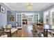 Elegant dining room featuring French doors, hardwood floors, and a stylish chandelier at 4721 Carrollton Ave, Indianapolis, IN 46205