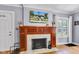 Elegant fireplace with wood mantle, marble surround, and decorative tile hearth at 4721 Carrollton Ave, Indianapolis, IN 46205