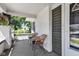 Cozy front porch featuring brick accents and inviting outdoor seating at 4721 Carrollton Ave, Indianapolis, IN 46205