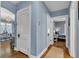 Hallway with an archway that leads to the dining room and a bedroom at 4721 Carrollton Ave, Indianapolis, IN 46205