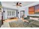 Bright living room with hardwood floors, large windows, and a decorative fireplace at 4721 Carrollton Ave, Indianapolis, IN 46205