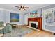 Spacious living room with hardwood floors, fireplace, and natural light at 4721 Carrollton Ave, Indianapolis, IN 46205