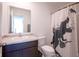 Modern bathroom with a stylish vanity, toilet, and shower with a decorative curtain at 507 Redvine Dr, Sheridan, IN 46069