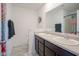 Bathroom with double sink vanity, modern fixtures, and a large mirror and tiled floor at 507 Redvine Dr, Sheridan, IN 46069