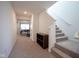 Bright entryway featuring a staircase, neutral carpeting, and an inviting glimpse of the living area at 507 Redvine Dr, Sheridan, IN 46069