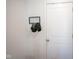Clean entryway featuring a white door with a modern hat rack and hooks for added convenience at 507 Redvine Dr, Sheridan, IN 46069