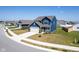 Charming blue two-story home showcasing a paved driveway and verdant front lawn in a friendly neighborhood at 507 Redvine Dr, Sheridan, IN 46069